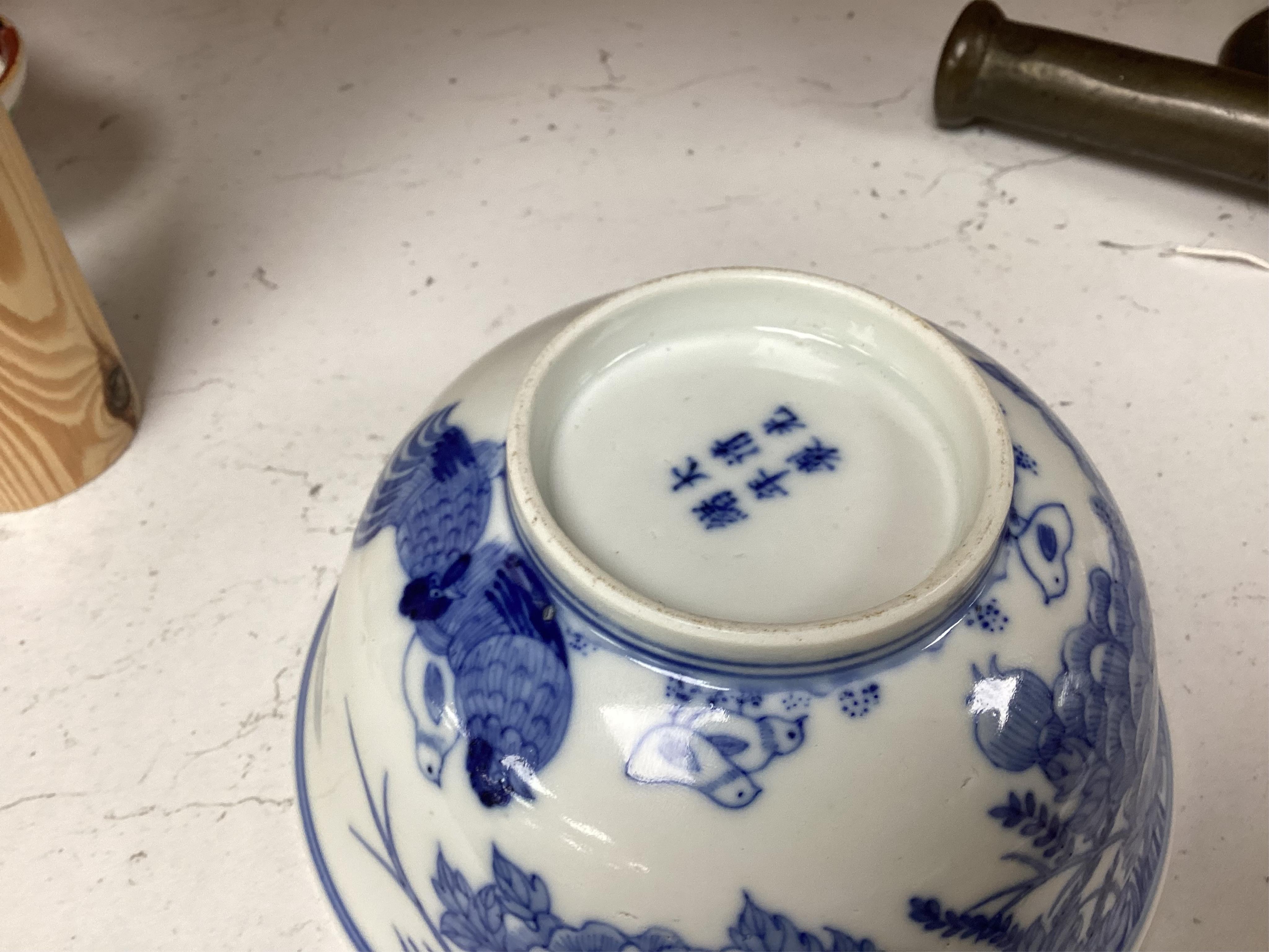 A Chinese blue and white bowl, decorated with flowers and birds, 14.5cm in diameter